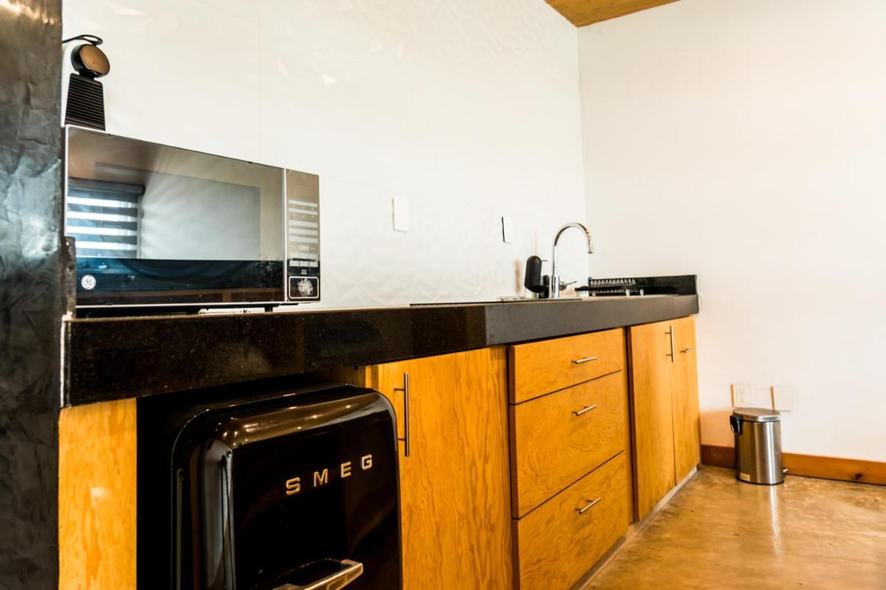 Casa Ticul Hotel Boutique - 5Th Ave (Adults Only) Playa del Carmen Bagian luar foto A kitchen with a refrigerator, stove, and oven